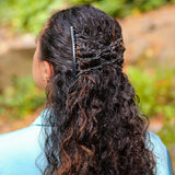 curly woman wearing black comfy combs