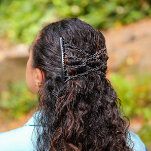 comfy comb wearing by woman with curly hair